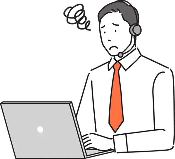 困った表情でパソコンを触る男性